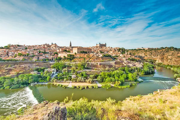 Panoramic golden hour view of historic Toledo Spain from the Mirador del Valle, a top day trip destination from Madrid. Panoramic golden hour view of historic Toledo Spain from the Mirador del Valle, a top day trip destination from Madrid.