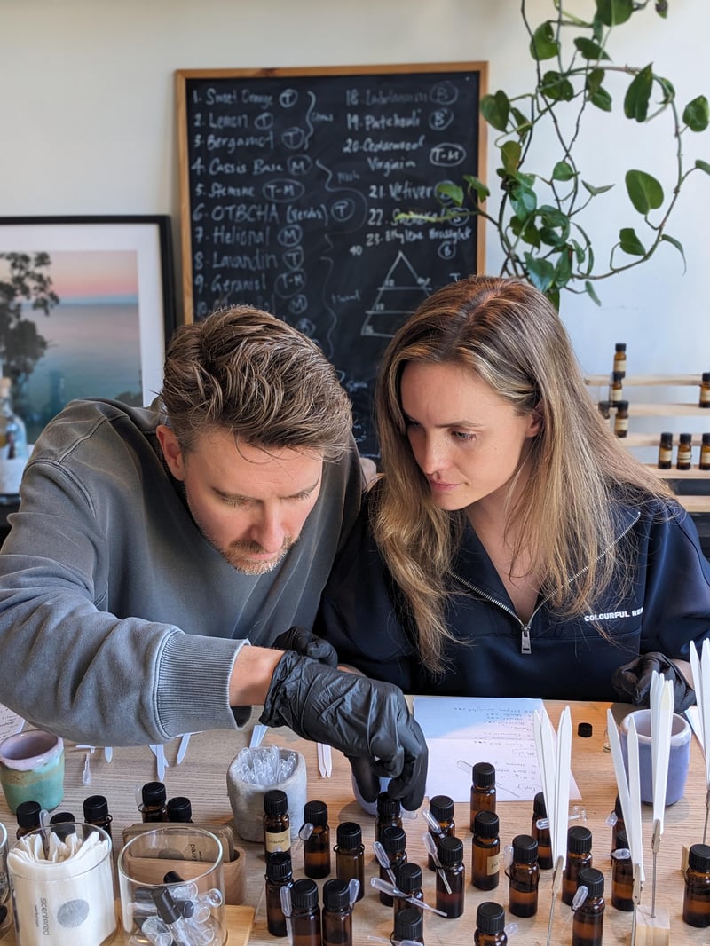 Guests participating in a mindful perfume-making workshop at a cozy studio in Amsterdam Guests participating in a mindful perfume-making workshop at a cozy studio in Amsterdam