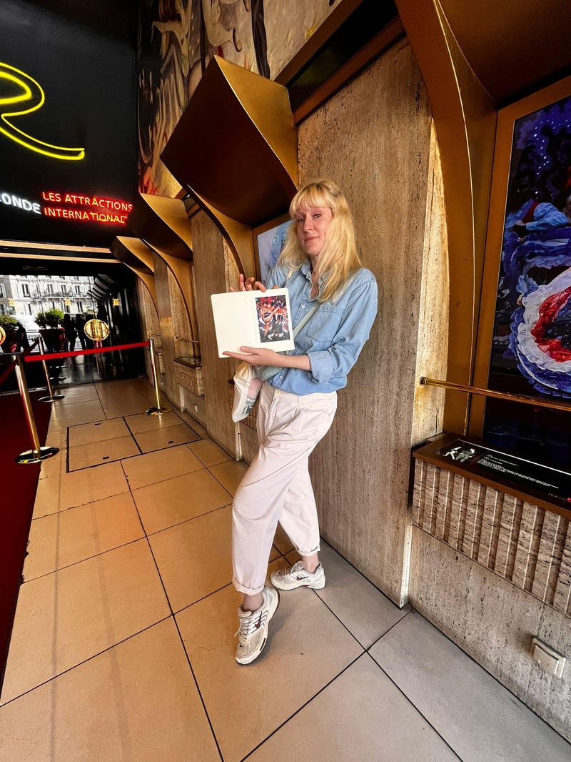 A local guide leading a small hidden art tour on a cobblestone street in Montmartre, Paris A local guide leading a small hidden art tour on a cobblestone street in Montmartre, Paris