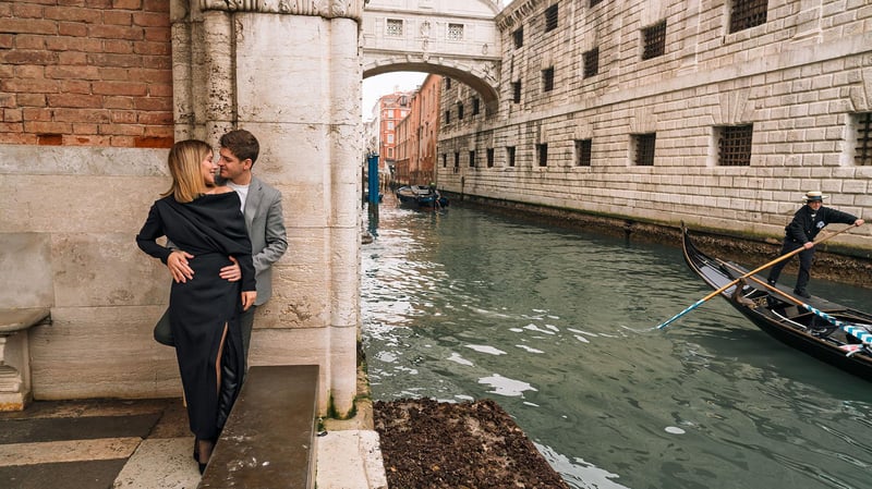 Romantic couple photoshoot with a professional photographer on a Venetian bridge at sunset, capturing authentic moments with canal reflections. Romantic couple photoshoot with a professional photographer on a Venetian bridge at sunset, capturing authentic moments with canal reflections.