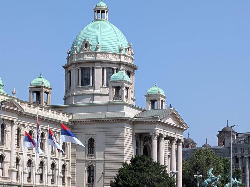 A guided walking tour group exploring the historic Belgrade Fortress with a guide pointing out the view of the river confluence. A guided walking tour group exploring the historic Belgrade Fortress with a guide pointing out the view of the river confluence.