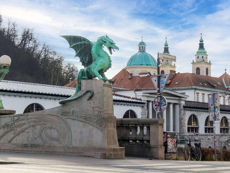Traditional Pletna boat on the emerald waters of Lake Bled heading towards the island church with Bled Castle in the background. Traditional Pletna boat on the emerald waters of Lake Bled heading towards the island church with Bled Castle in the background.