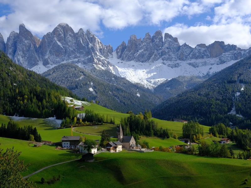 Panoramic view of the Dolomites mountains reflecting in Lake Misurina on a day trip from Venice, Italy Panoramic view of the Dolomites mountains reflecting in Lake Misurina on a day trip from Venice, Italy