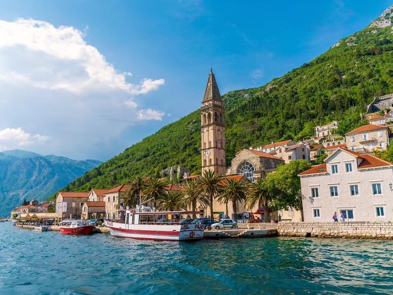 Inside view of the glowing Blue Cave in Montenegro from a speedboat, with swimmers in turquoise water. Inside view of the glowing Blue Cave in Montenegro from a speedboat, with swimmers in turquoise water.