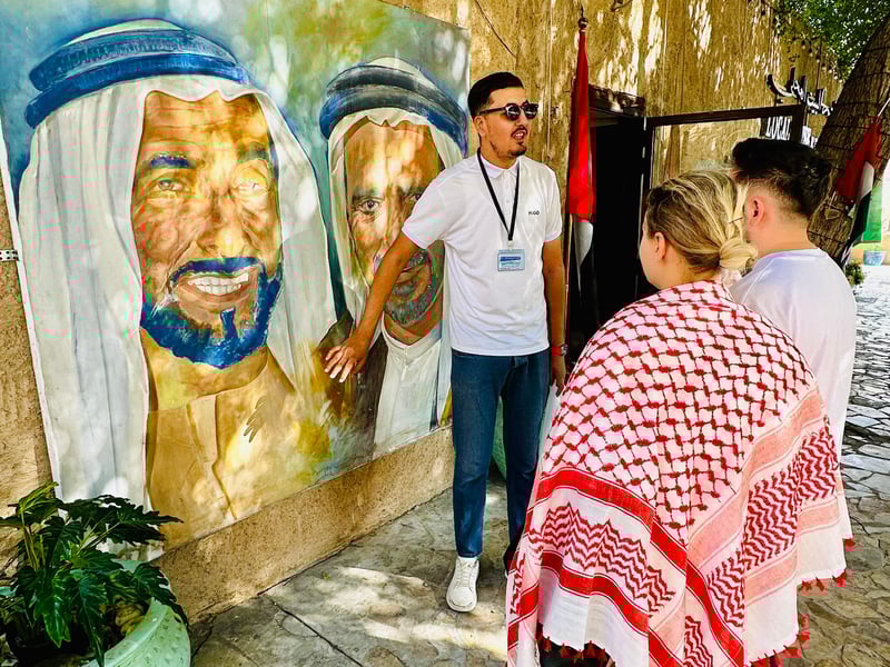 A personal shopping guide showing exquisite gold jewelry to visitors in the vibrant Dubai Gold Souk market. A personal shopping guide showing exquisite gold jewelry to visitors in the vibrant Dubai Gold Souk market.