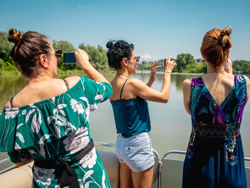 Luxury private pontoon boat cruise on the Danube River in Belgrade at sunset with guests and Kalemegdan Fortress view Luxury private pontoon boat cruise on the Danube River in Belgrade at sunset with guests and Kalemegdan Fortress view