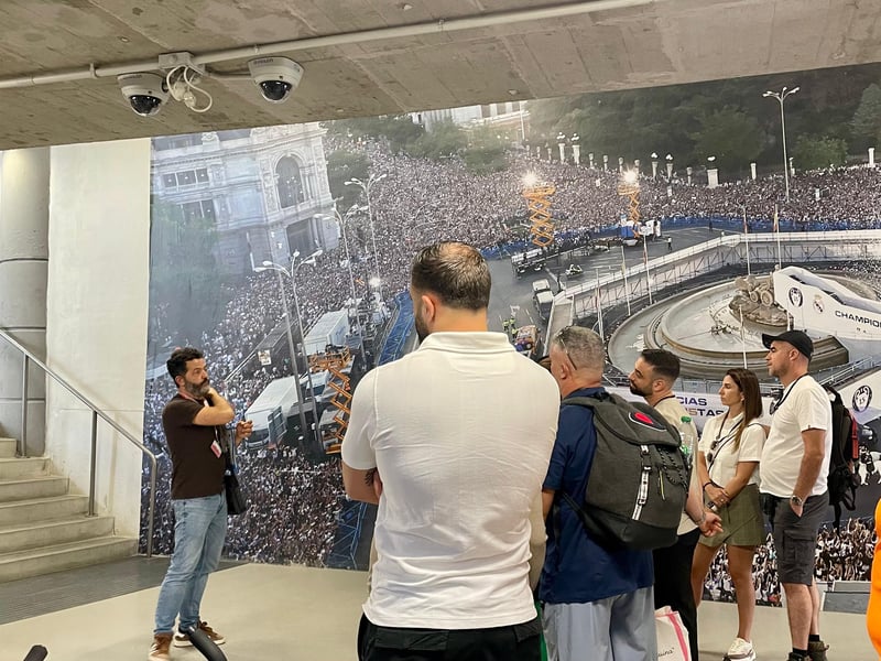 Happy family enjoying an electric tuk-tuk tour in Madrid with the Royal Palace in the background Happy family enjoying an electric tuk-tuk tour in Madrid with the Royal Palace in the background