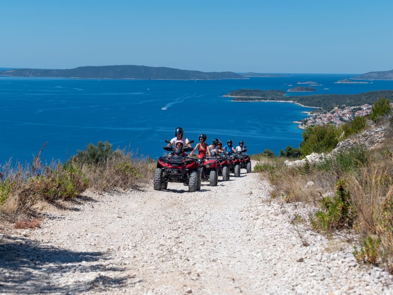 ATV quad bikes on a dusty mountain trail in Split, Croatia with panoramic sea views ATV quad bikes on a dusty mountain trail in Split, Croatia with panoramic sea views