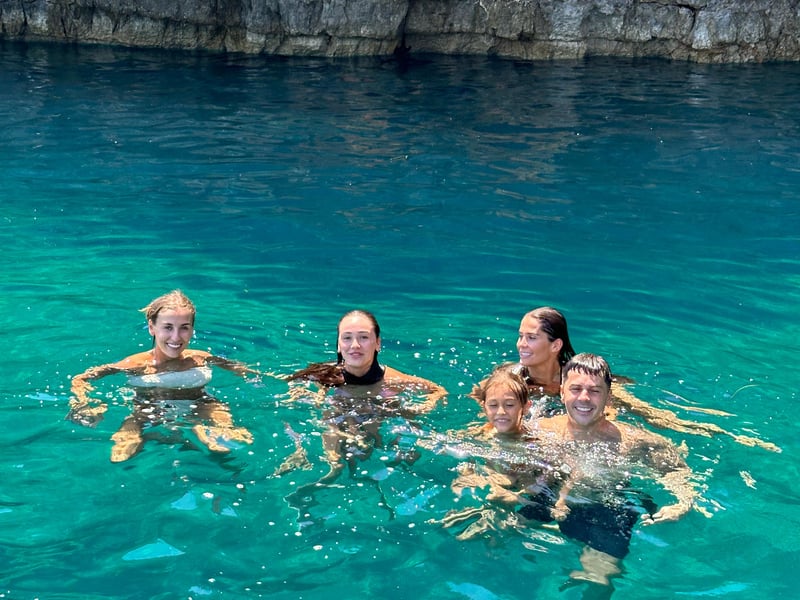 Authentic Montenegrin picnic with prosciutto and cheese on a scenic cliff overlooking the Bay of Kotor Authentic Montenegrin picnic with prosciutto and cheese on a scenic cliff overlooking the Bay of Kotor