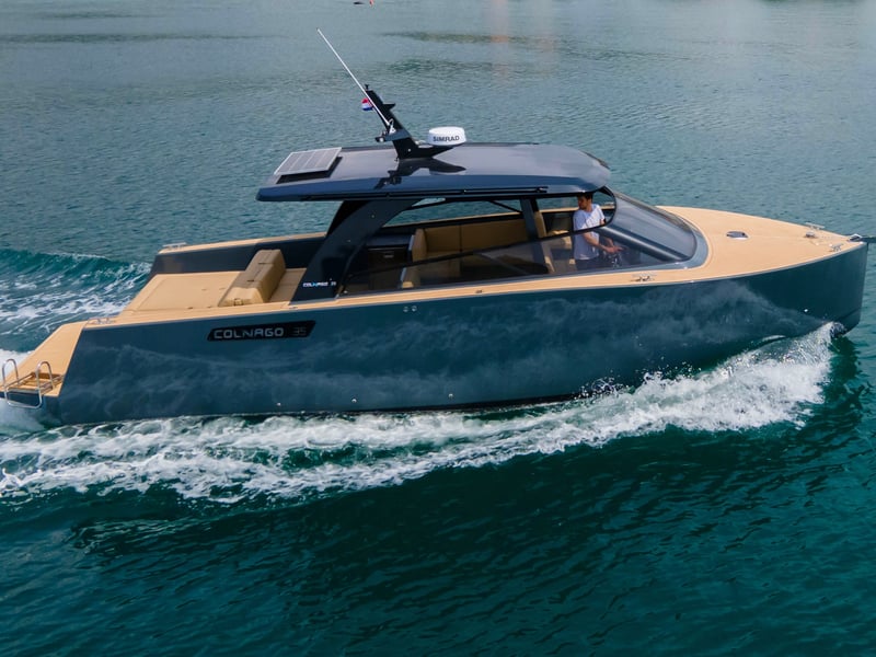Aerial view of a speedboat tour from Makarska, Croatia, in the stunning blue Adriatic Sea with mountains and islands in the background. Aerial view of a speedboat tour from Makarska, Croatia, in the stunning blue Adriatic Sea with mountains and islands in the background.