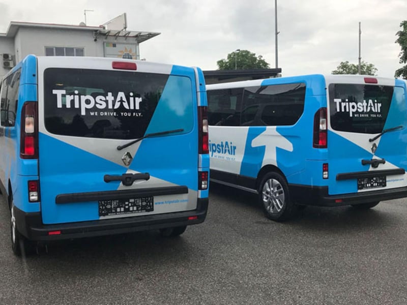 Modern coach bus for Ljubljana airport transfer on a scenic Slovenian mountain road Modern coach bus for Ljubljana airport transfer on a scenic Slovenian mountain road