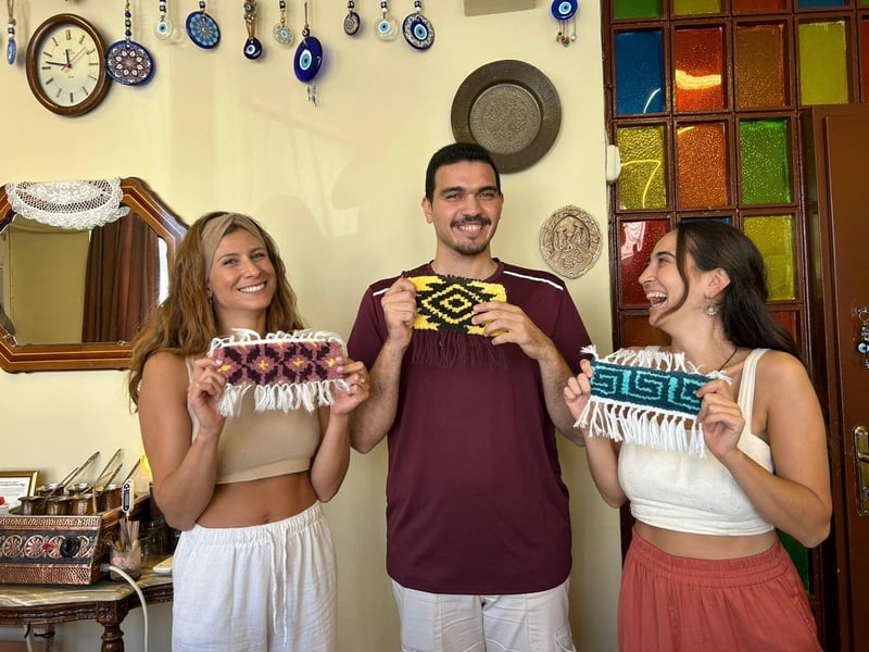 Hands weaving a vibrant traditional Turkish carpet on a loom in a cozy Istanbul workshop, a unique cultural hidden gem experience. Hands weaving a vibrant traditional Turkish carpet on a loom in a cozy Istanbul workshop, a unique cultural hidden gem experience.