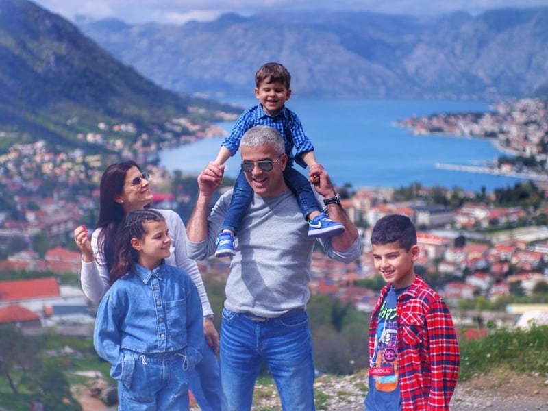 Panoramic view of the iconic Sveti Stefan island hotel and stone buildings from a scenic coastal viewpoint in Montenegro Panoramic view of the iconic Sveti Stefan island hotel and stone buildings from a scenic coastal viewpoint in Montenegro