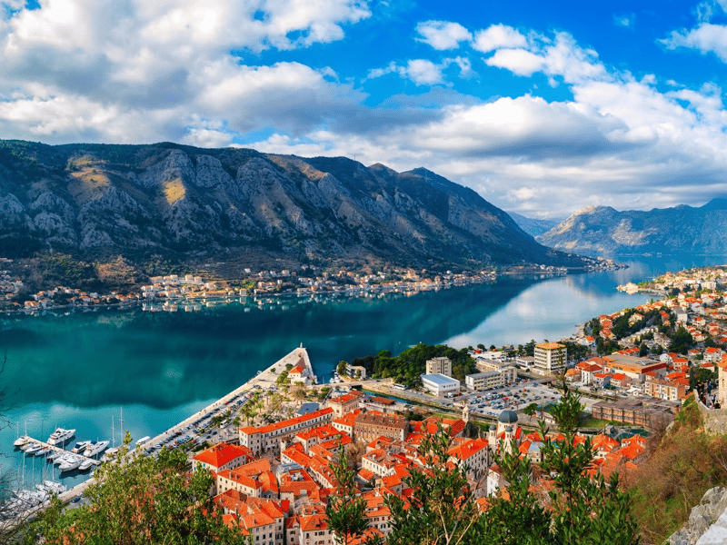 Panoramic sunset view of Budva Old Town with medieval walls and Adriatic Sea in Montenegro Panoramic sunset view of Budva Old Town with medieval walls and Adriatic Sea in Montenegro