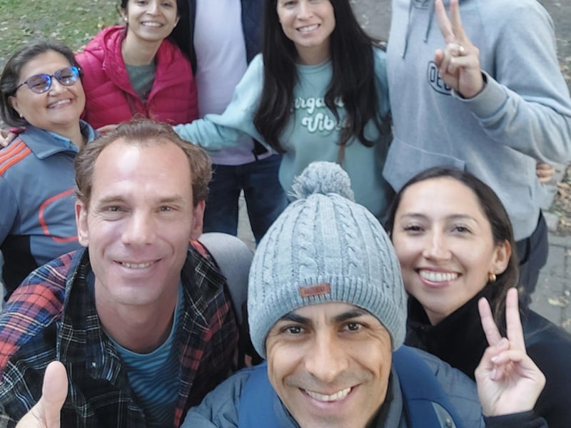 A guided walking tour group learning about history at the Berlin Wall Memorial in Berlin. A guided walking tour group learning about history at the Berlin Wall Memorial in Berlin.