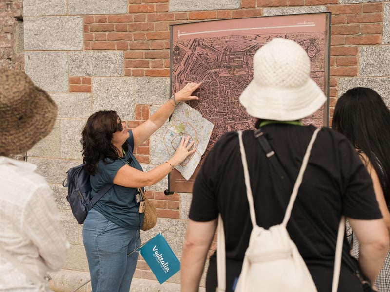 Panoramic view from Milan Duomo Cathedral rooftop terraces with Gothic spires against blue sky, showcasing fast entry access. Panoramic view from Milan Duomo Cathedral rooftop terraces with Gothic spires against blue sky, showcasing fast entry access.
