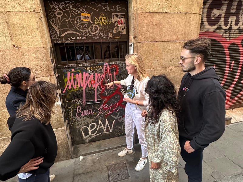 Close-up of hands shaping a colorful ceramic tile in a Barcelona artisan workshop, surrounded by pottery and tools. Close-up of hands shaping a colorful ceramic tile in a Barcelona artisan workshop, surrounded by pottery and tools.