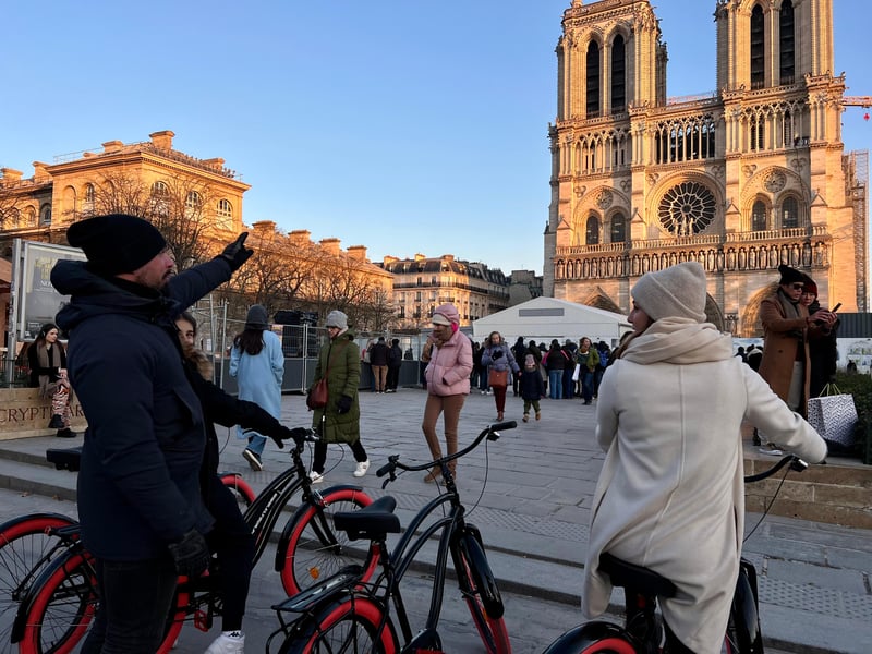 Small group on a scenic bike tour in Paris at dawn riding past the Eiffel Tower Small group on a scenic bike tour in Paris at dawn riding past the Eiffel Tower