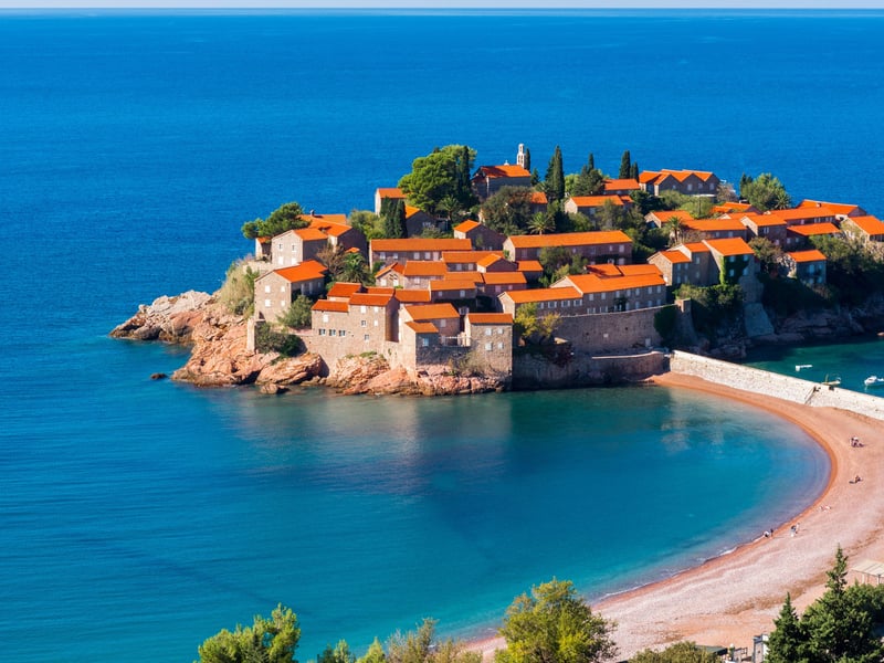 Panoramic view of Black Lake in Durmitor National Park, Montenegro, with mountains and forest reflected in the calm water. Panoramic view of Black Lake in Durmitor National Park, Montenegro, with mountains and forest reflected in the calm water.