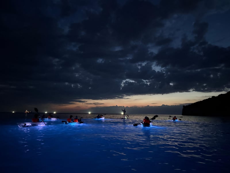 Glowing transparent kayak at night on the Adriatic Sea near Pula, illuminating the underwater world Glowing transparent kayak at night on the Adriatic Sea near Pula, illuminating the underwater world