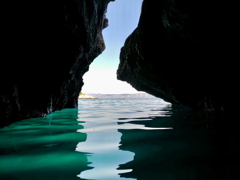 Speedboat sightseeing cruise on the turquoise Adriatic Sea near Makarska with Biokovo mountains in the background Speedboat sightseeing cruise on the turquoise Adriatic Sea near Makarska with Biokovo mountains in the background