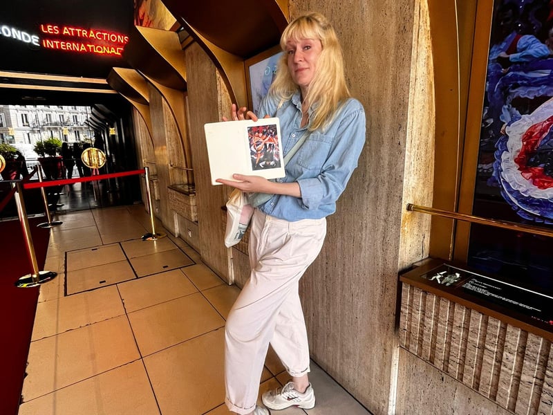 A friendly guided pop culture walking tour group exploring the charming streets of Montmartre in Paris with Sacré-Coeur in the background. A friendly guided pop culture walking tour group exploring the charming streets of Montmartre in Paris with Sacré-Coeur in the background.