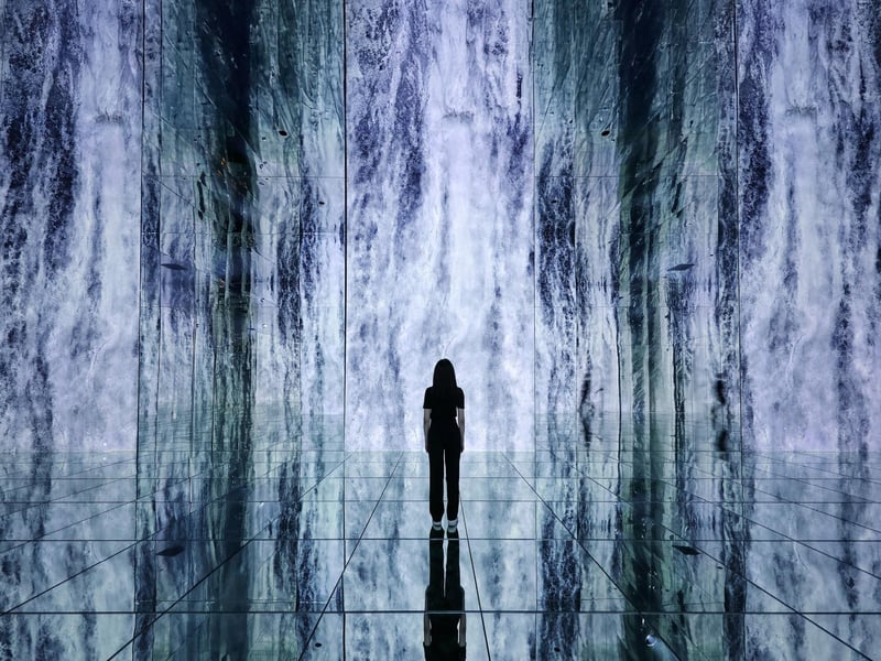 Visitors immersed in a stunning colorful digital art installation at Arte Museum New York Visitors immersed in a stunning colorful digital art installation at Arte Museum New York