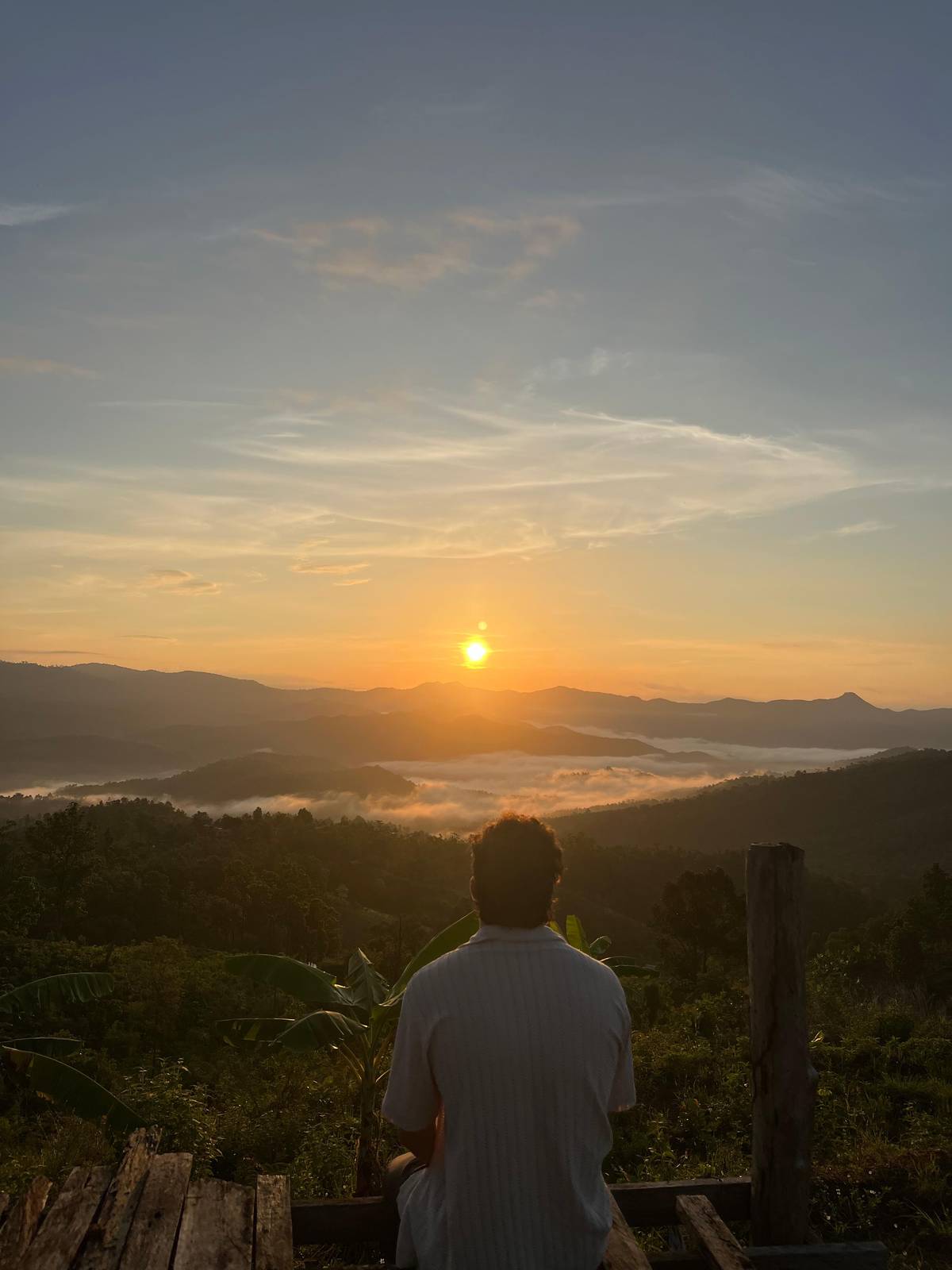 Sunrise over a valley filled with low cloud