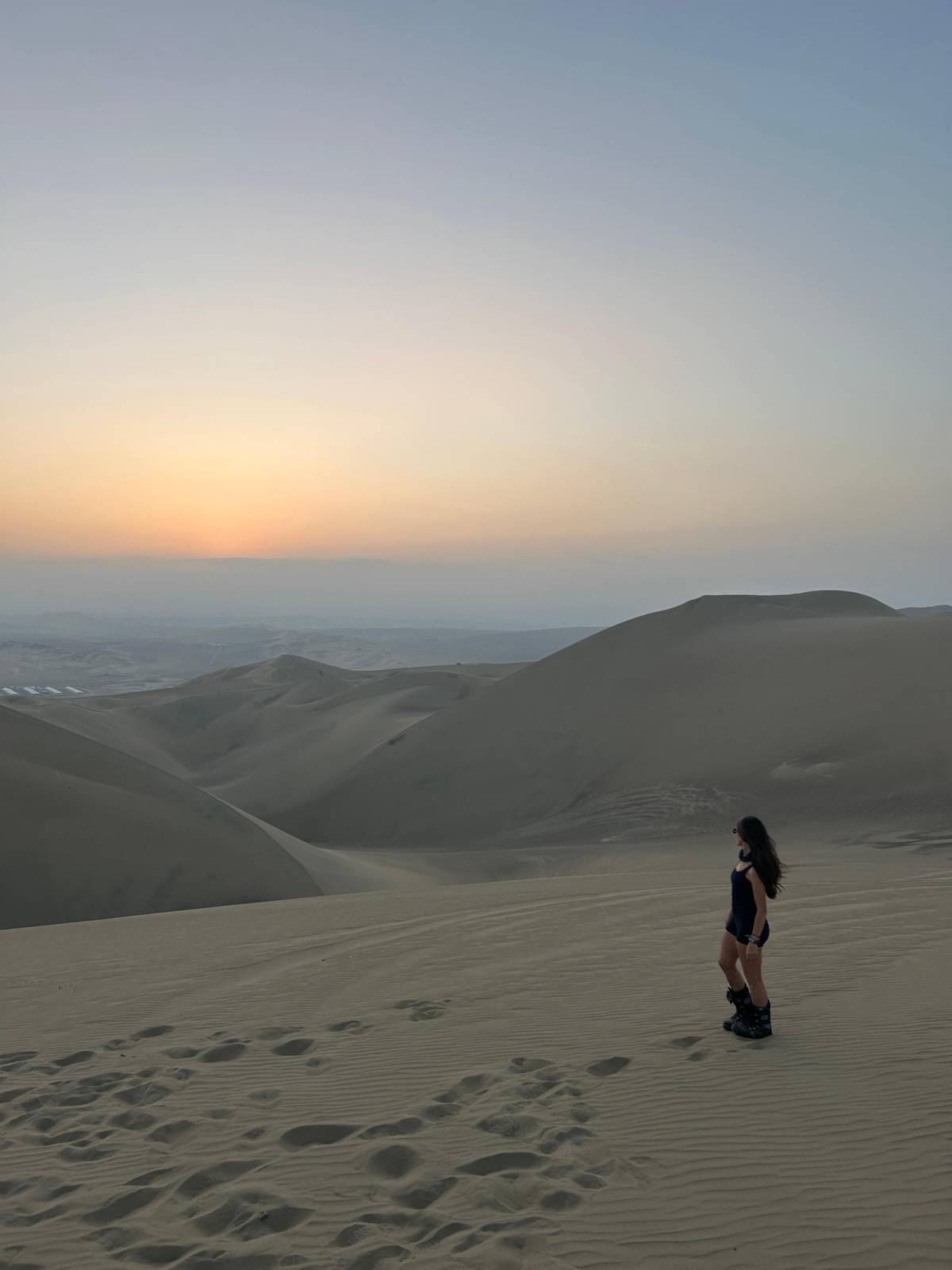 From a dune crest, A climb on foot above the oasis
