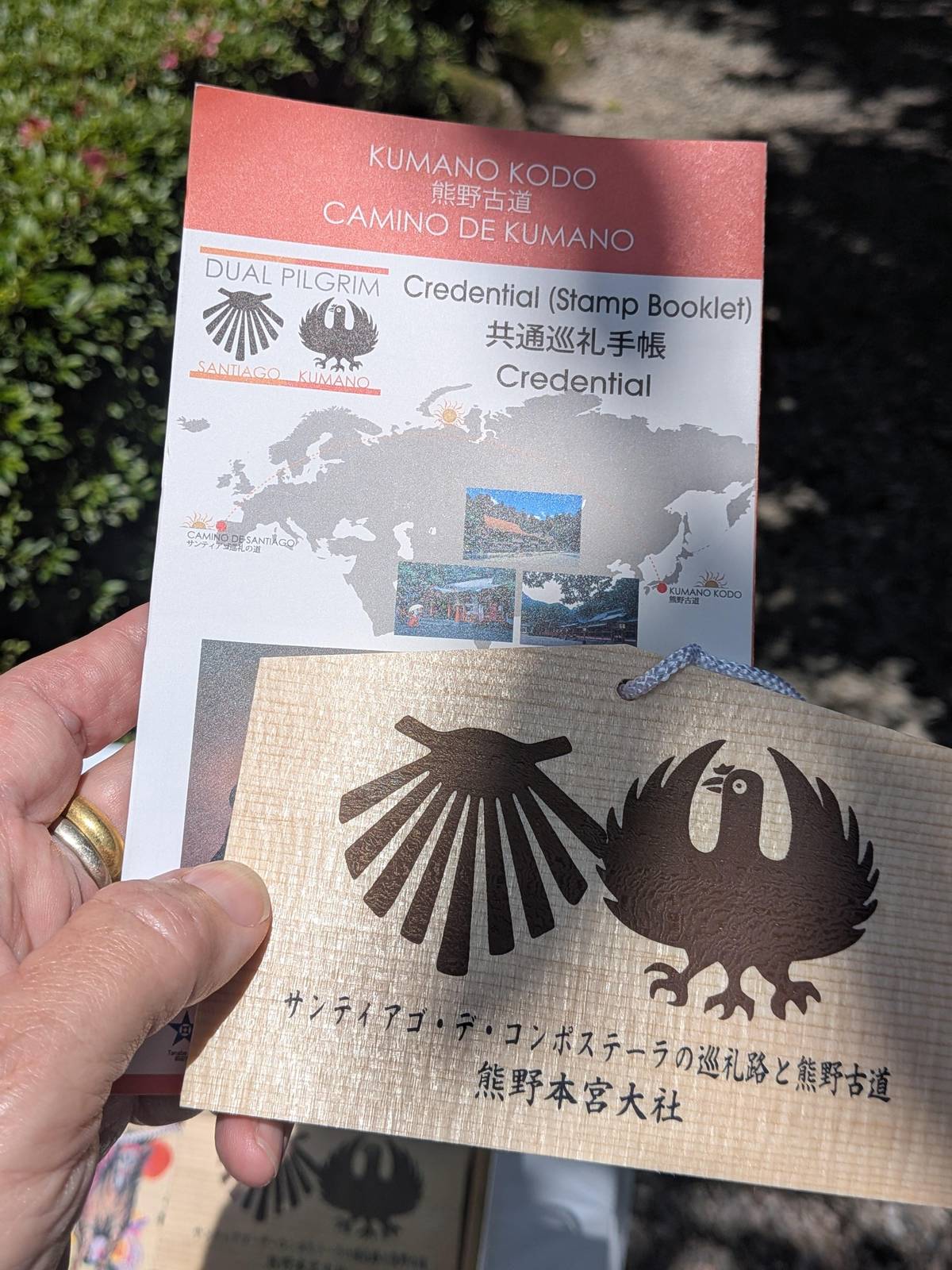 A pilgrim credential with the shell and crow emblems