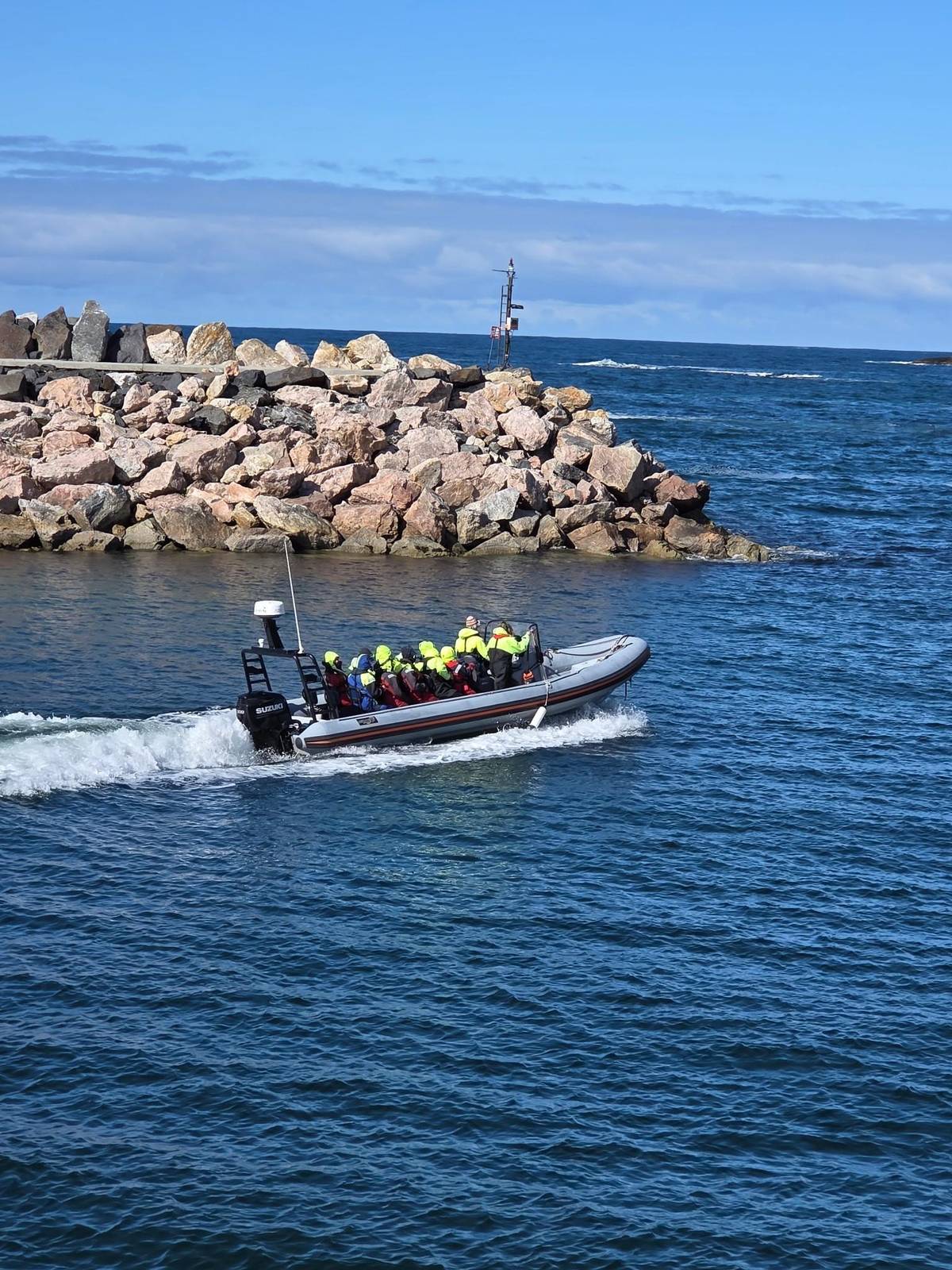 The RIB leaving the breakwater with guests aboard
