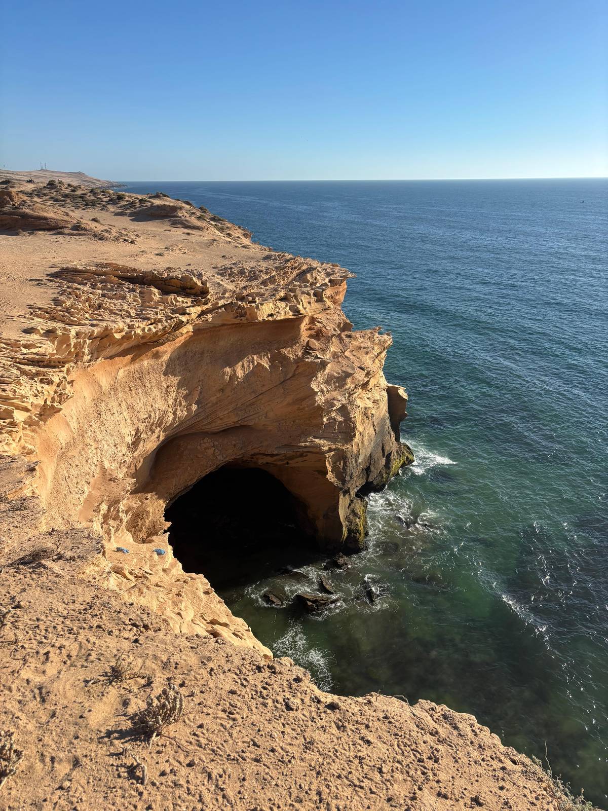 Sandstone cliffs over the ocean on the coast north of Agadir