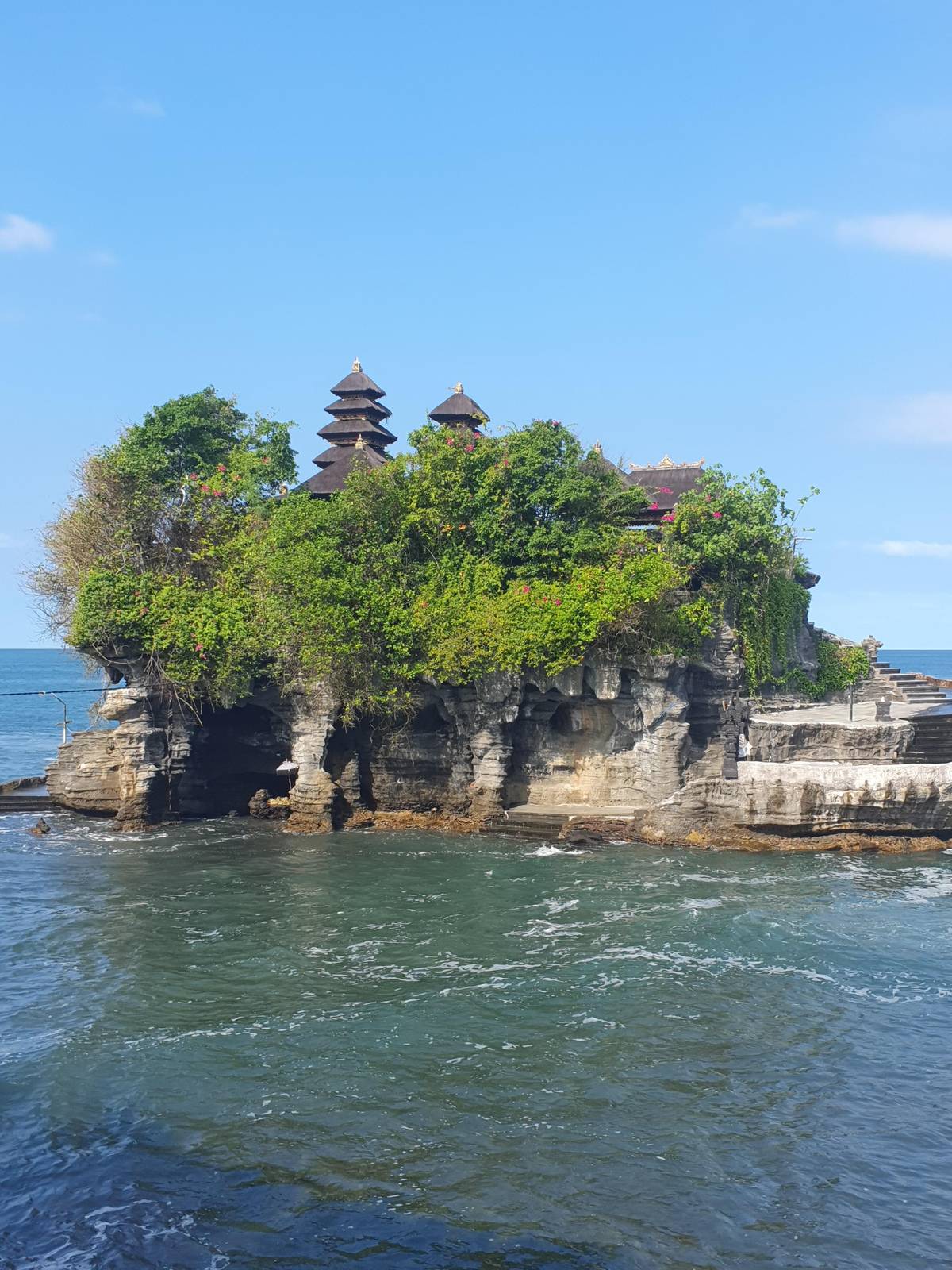 Tanah Lot temple on its rock with the sea around it