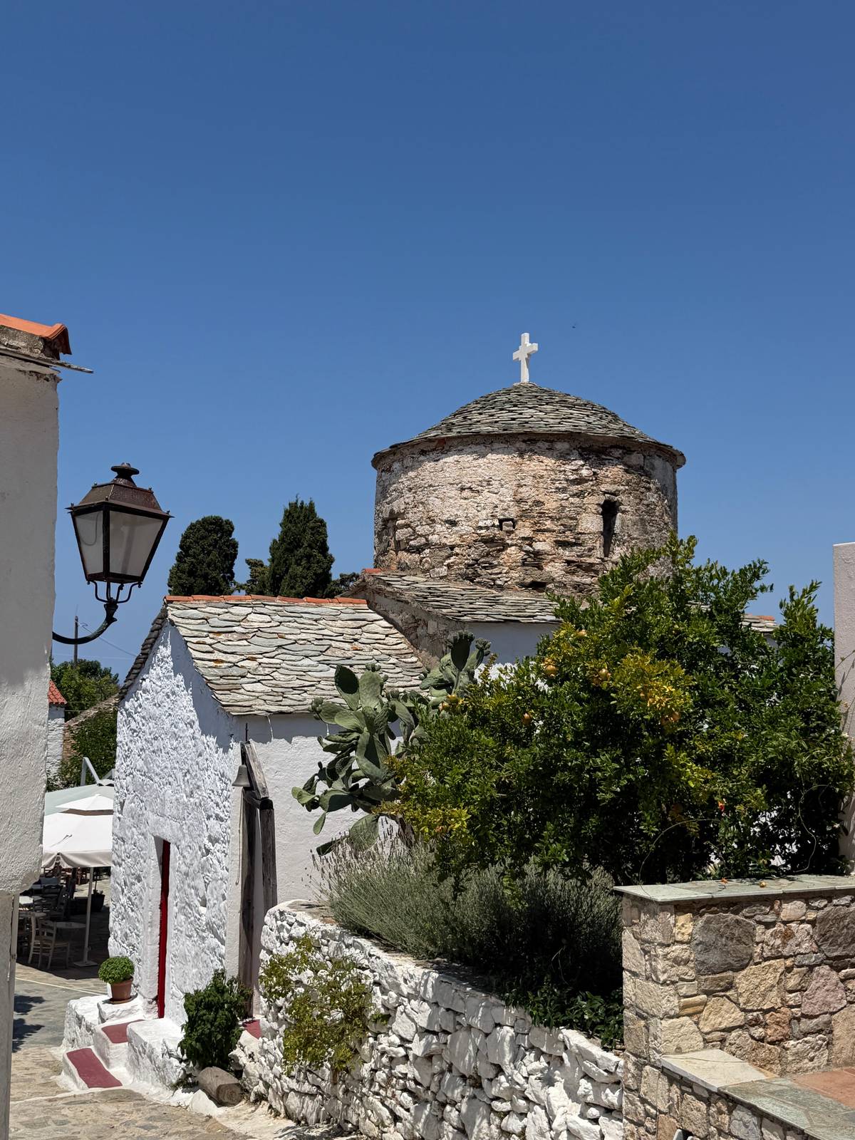 A stone chapel with a slate roof