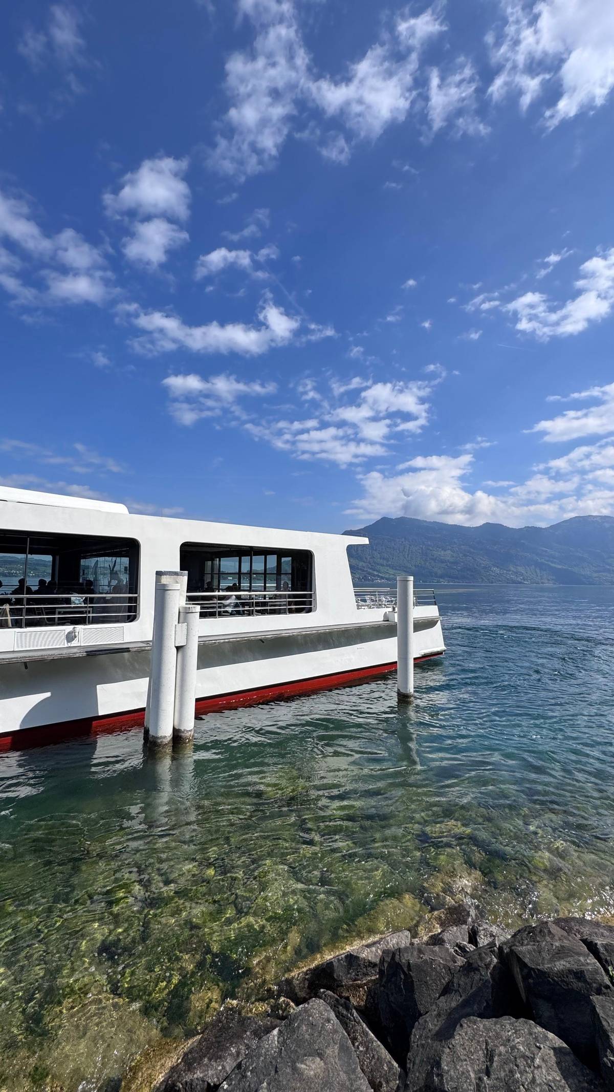 The catamaran tied up at a landing stage on Lake Lucerne