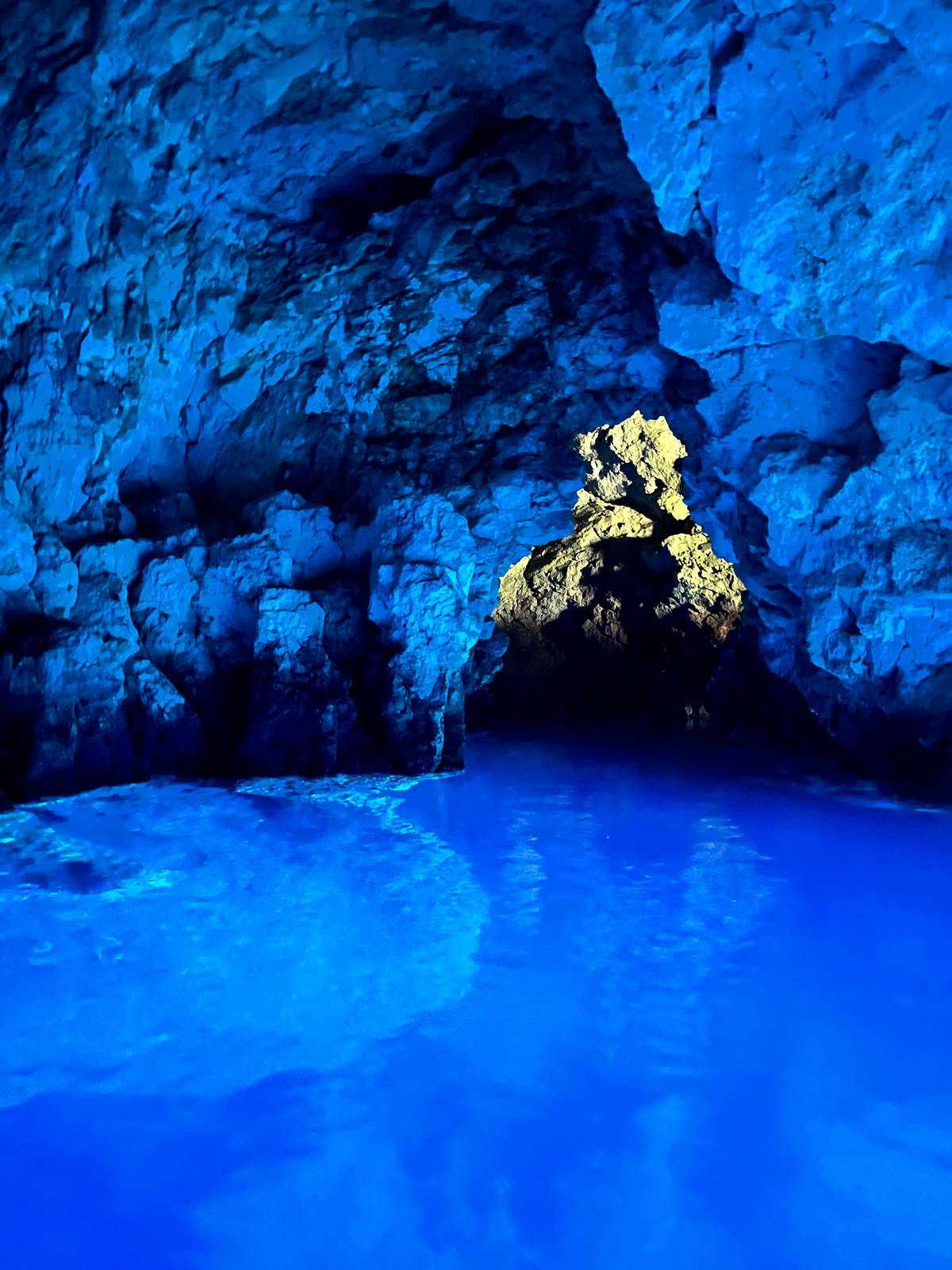 A rock in the middle of the glowing cave