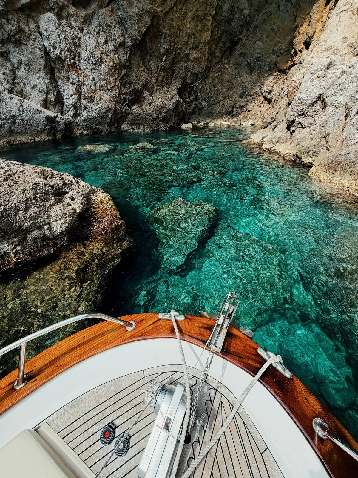Clear water under the bow of a wooden boat