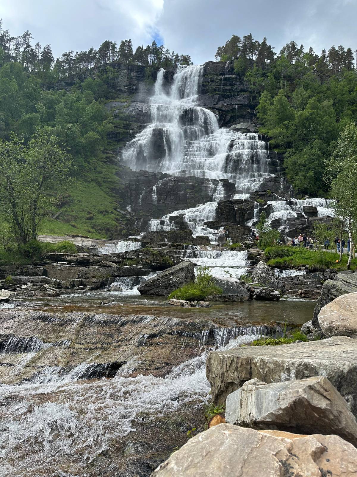 Tvindefossen spilling over its rock steps