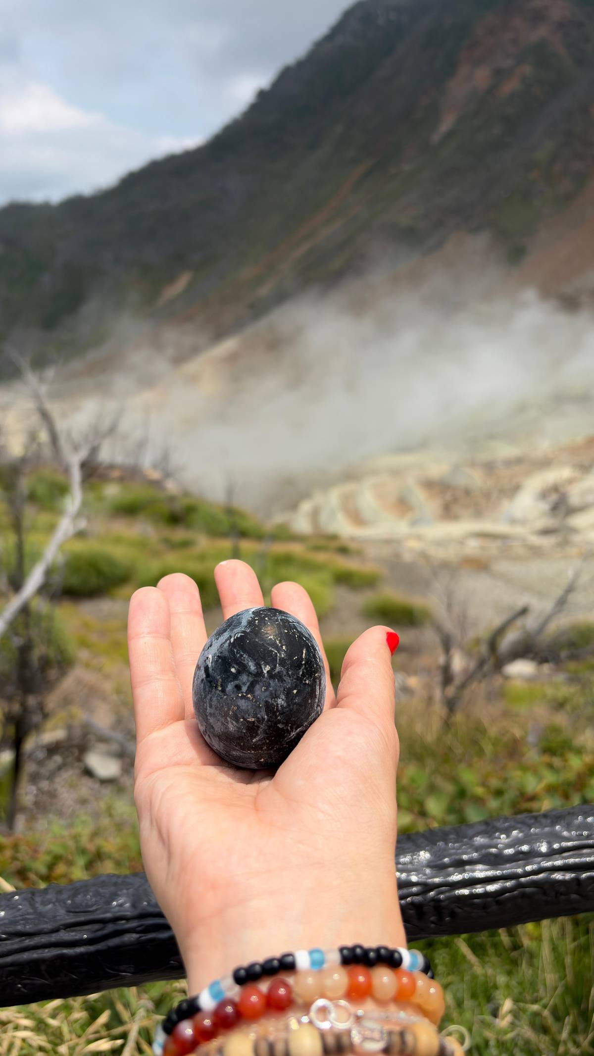 A black egg from Owakudani held in a hand