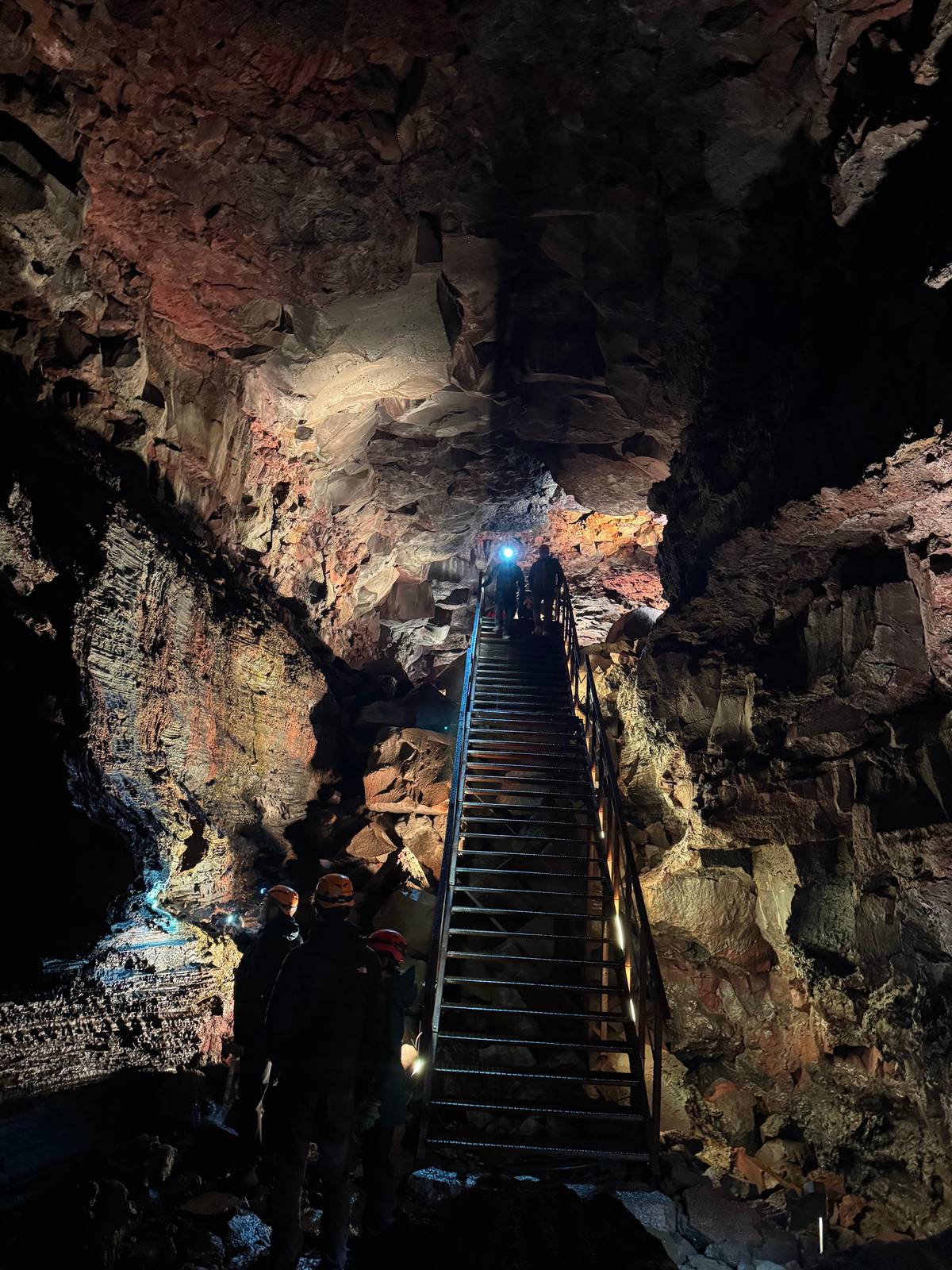 A long staircase deeper in the tube