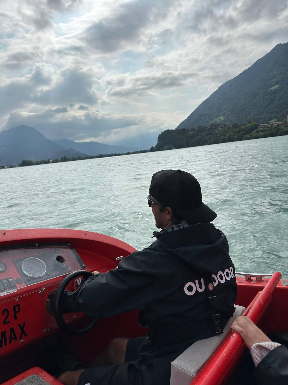 The captain at the wheel of the jetboat