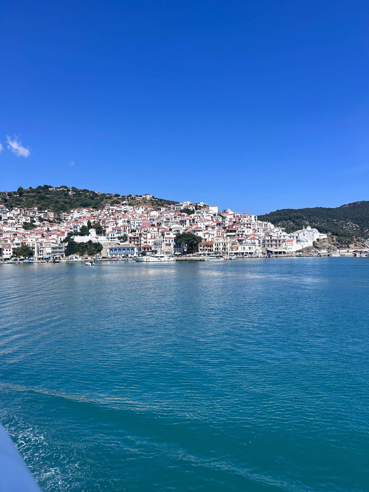 Arriving at a white island town above the harbor