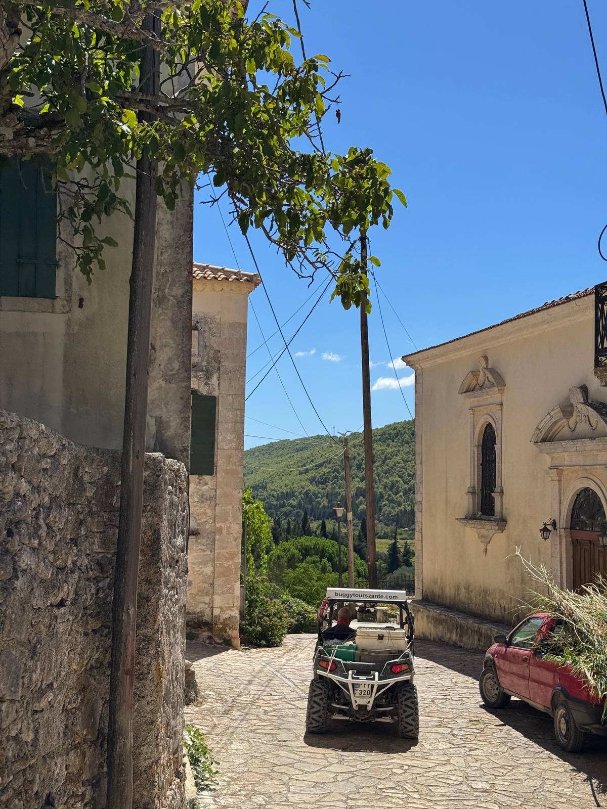 A buggy parked by a village church