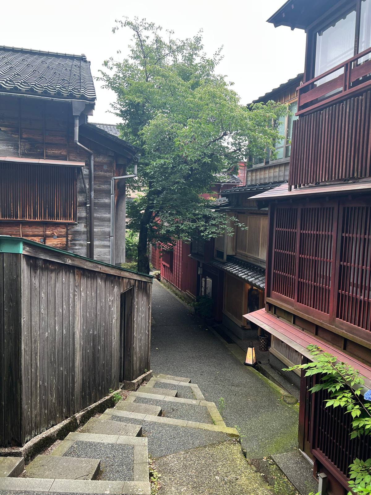 A stone lane between old wooden houses