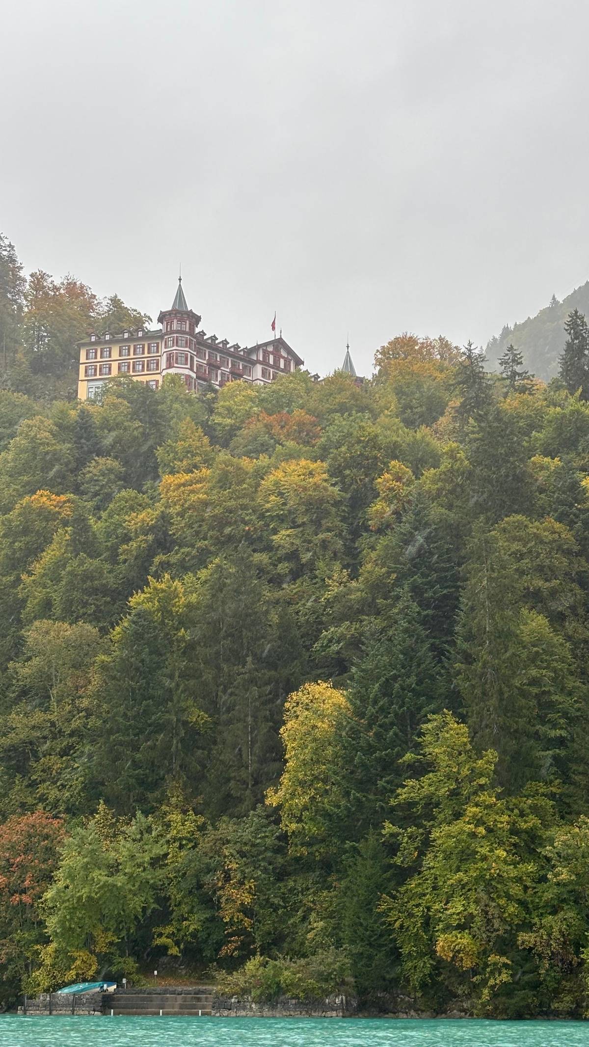 The Grandhotel Giessbach among autumn trees