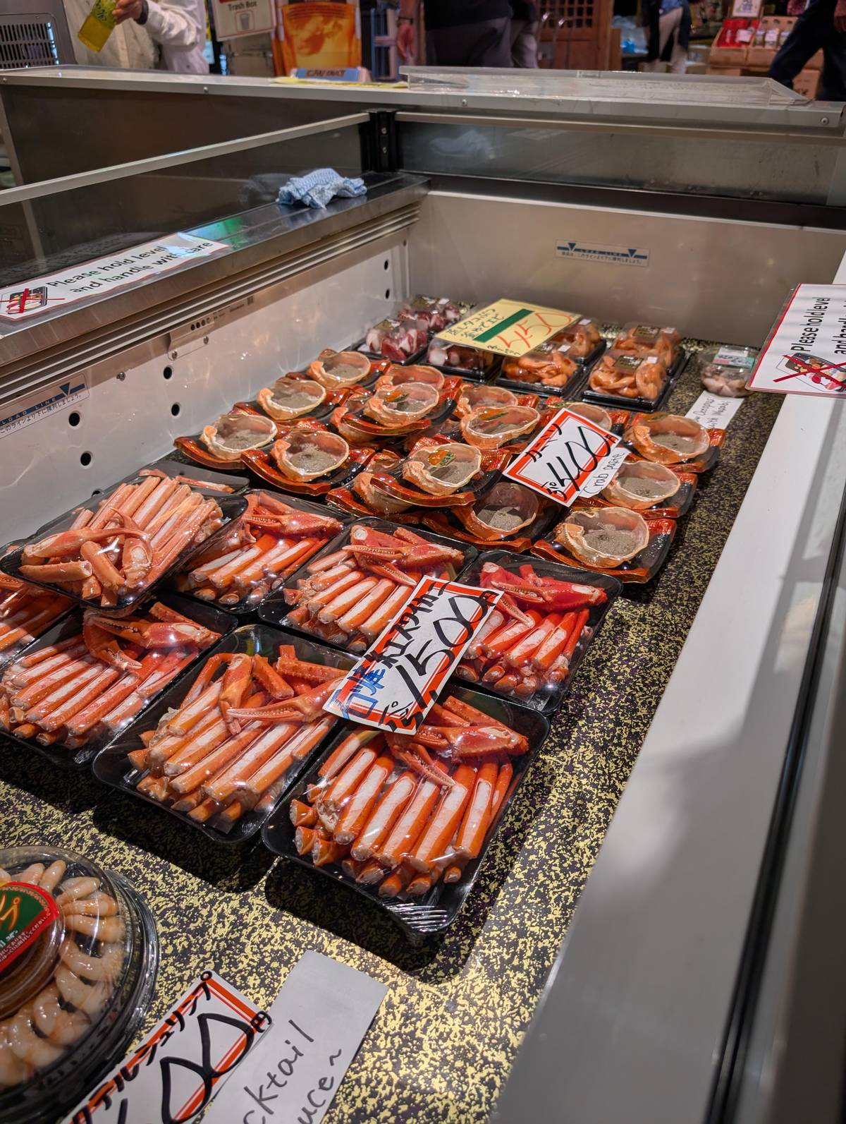Snow crab legs packed in a market fridge