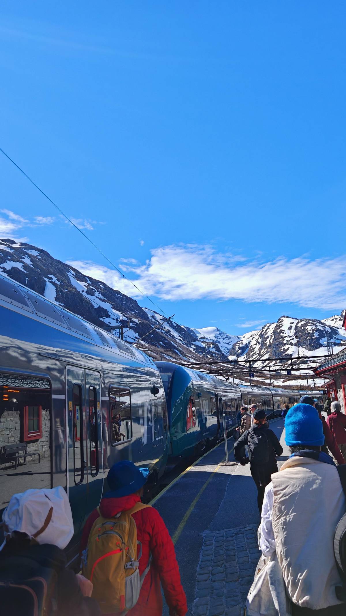 A train at a snowy mountain station