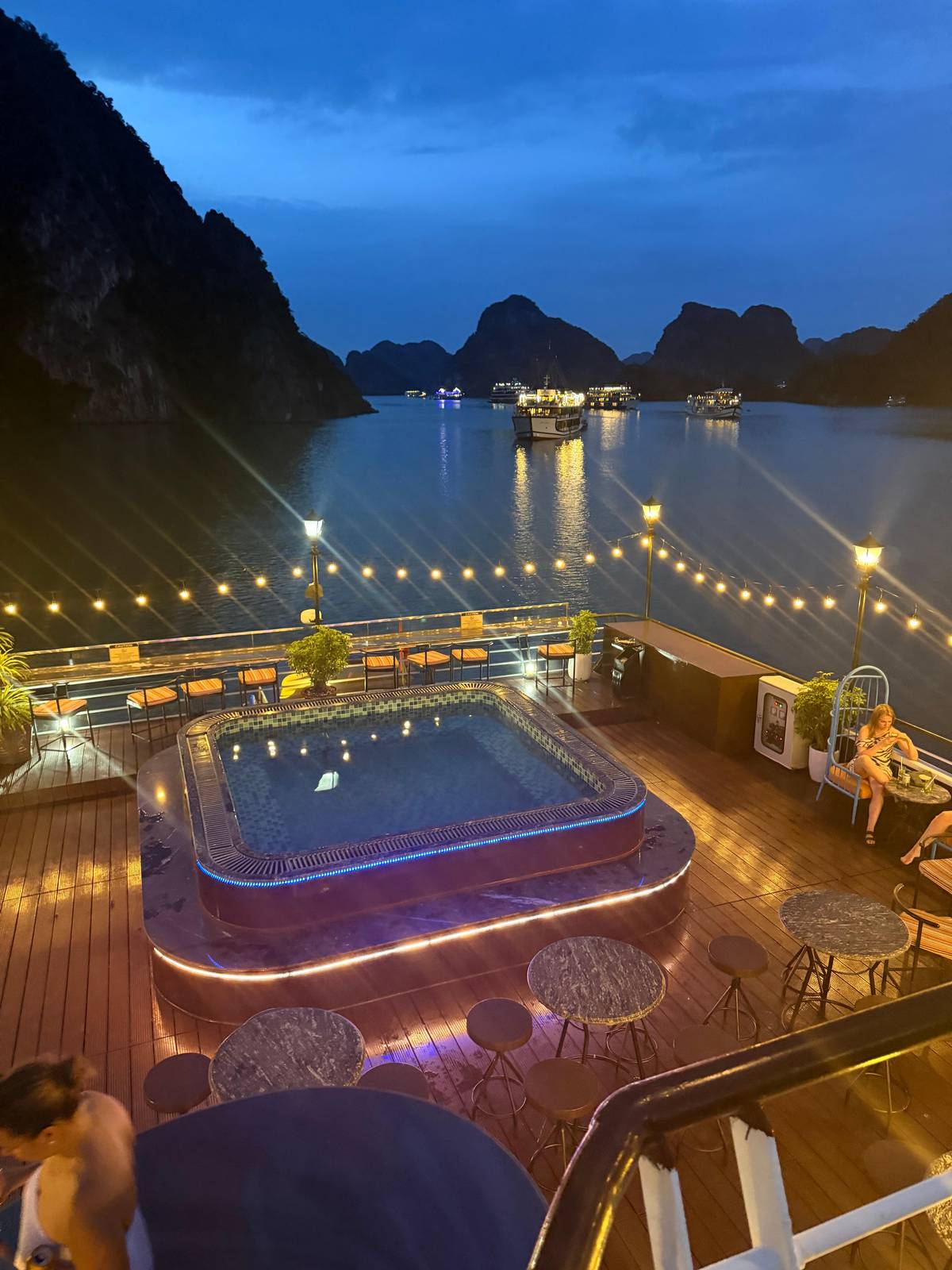 The pool deck lit up at night
