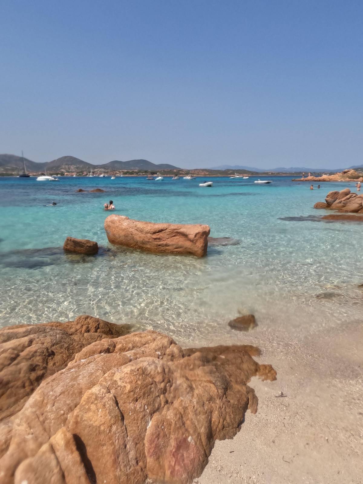 Granite boulders on a sandy beach
