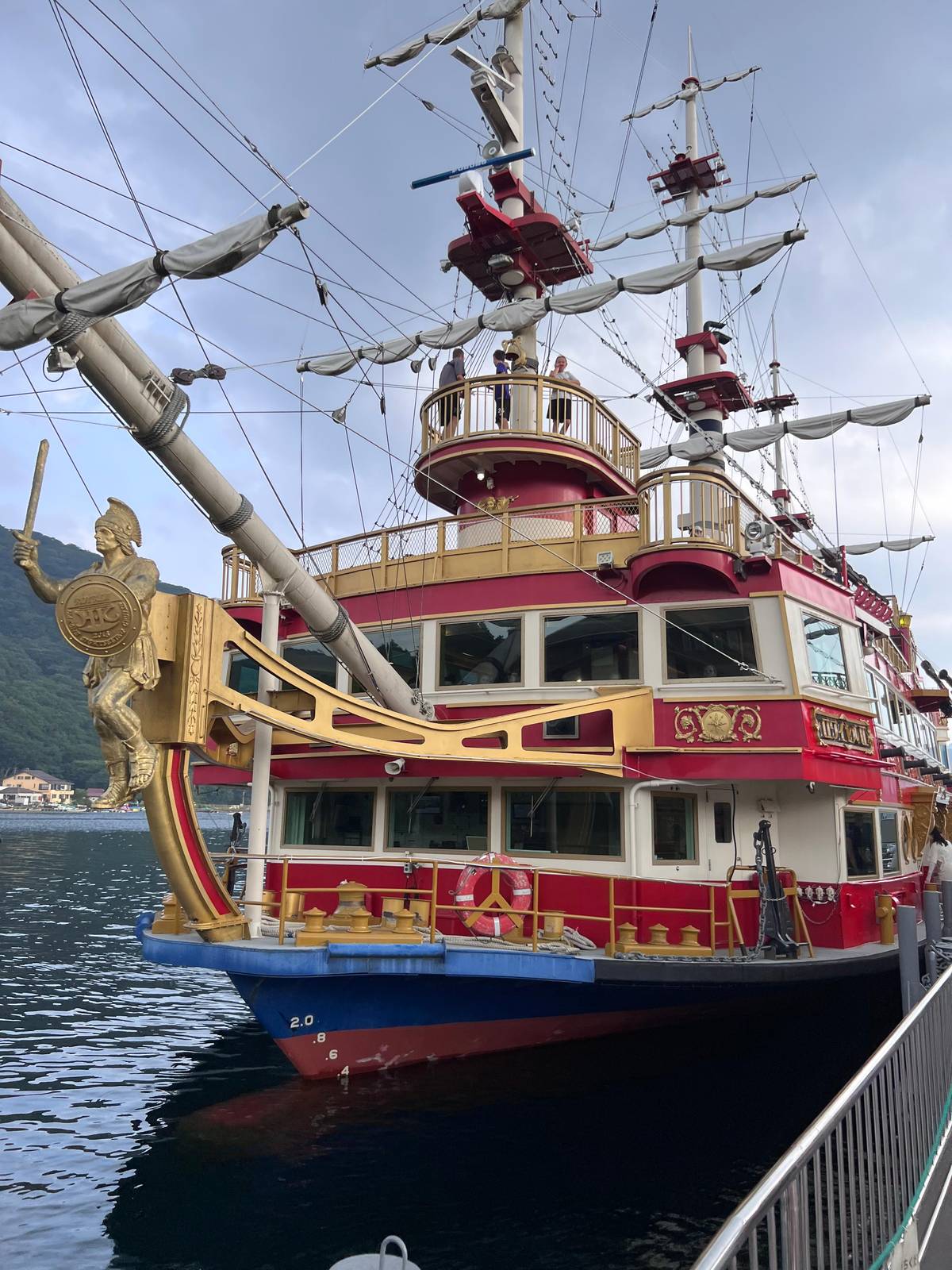 A red and gold pirate ship at the port